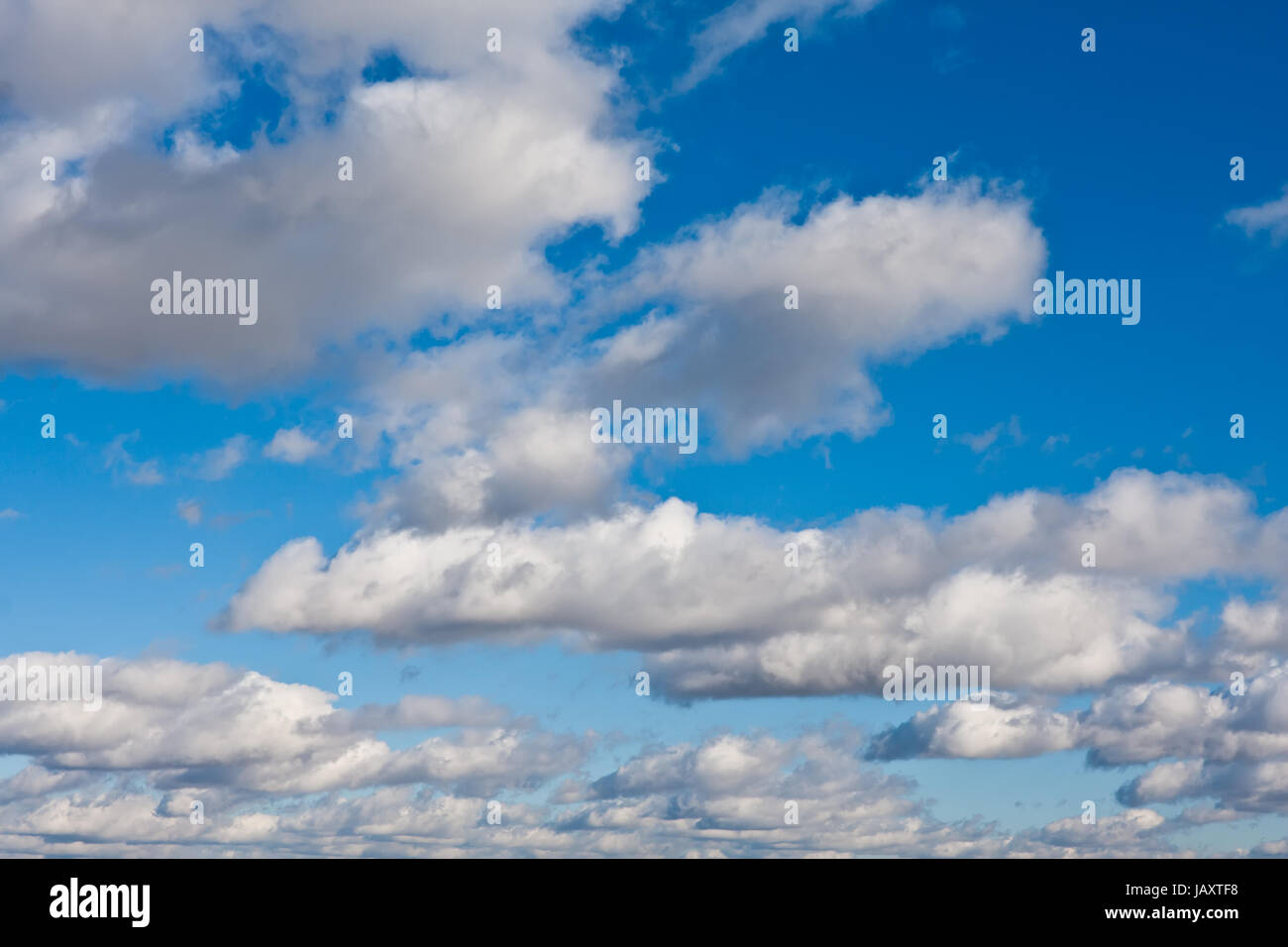 White clouds in blue summer sky background Stock Photo - Alamy
