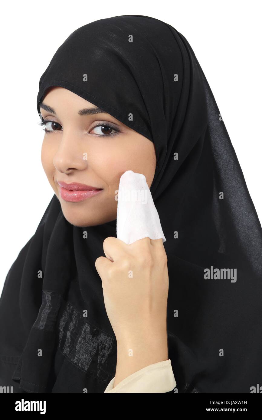 Arab woman cleaning her face with a baby wipe isolated on a white