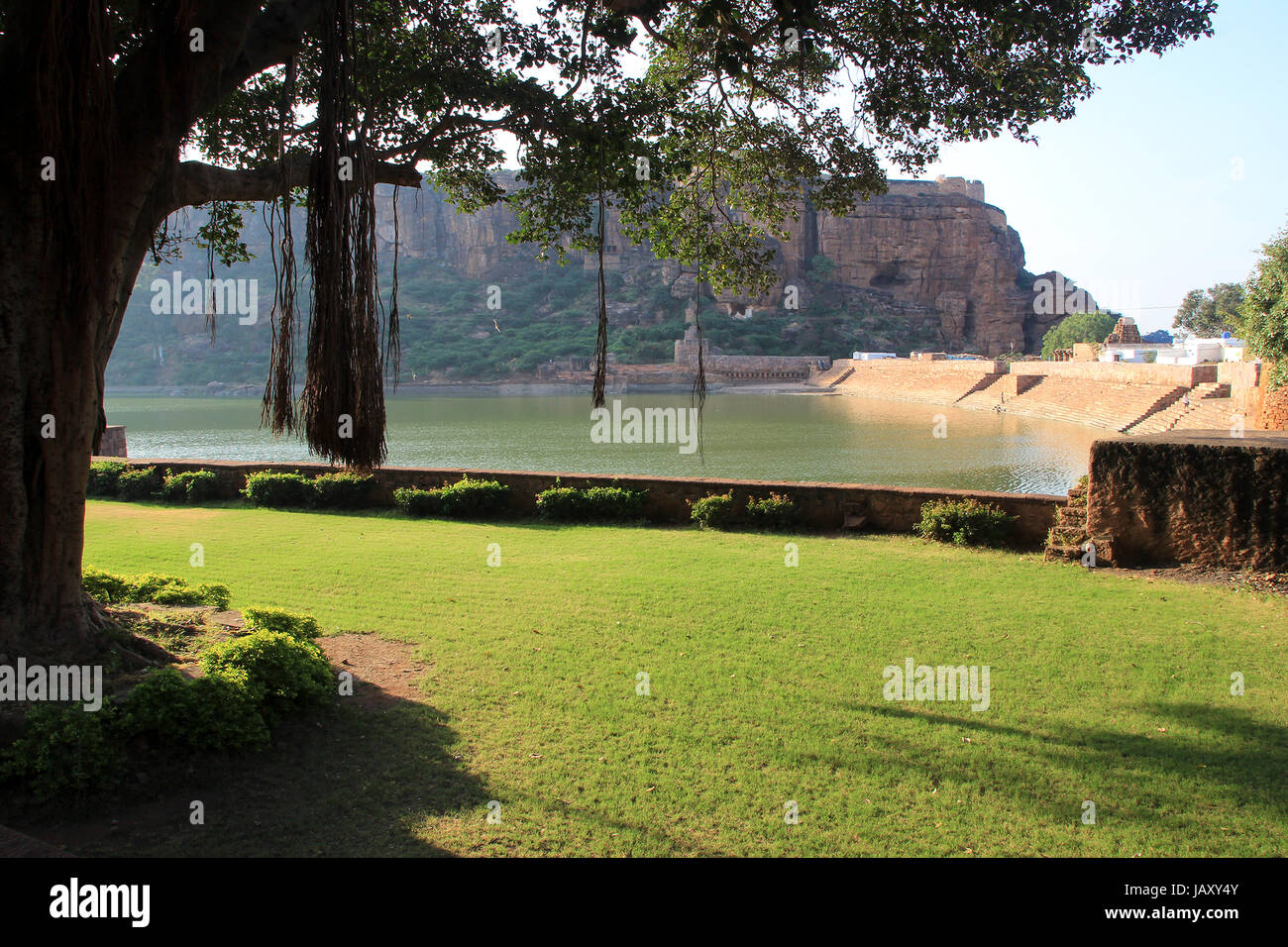 Landscaped garden, Agasthya Teertha Lake and southern cave temple hill at Badami, Karnataka, India, Asia Stock Photo