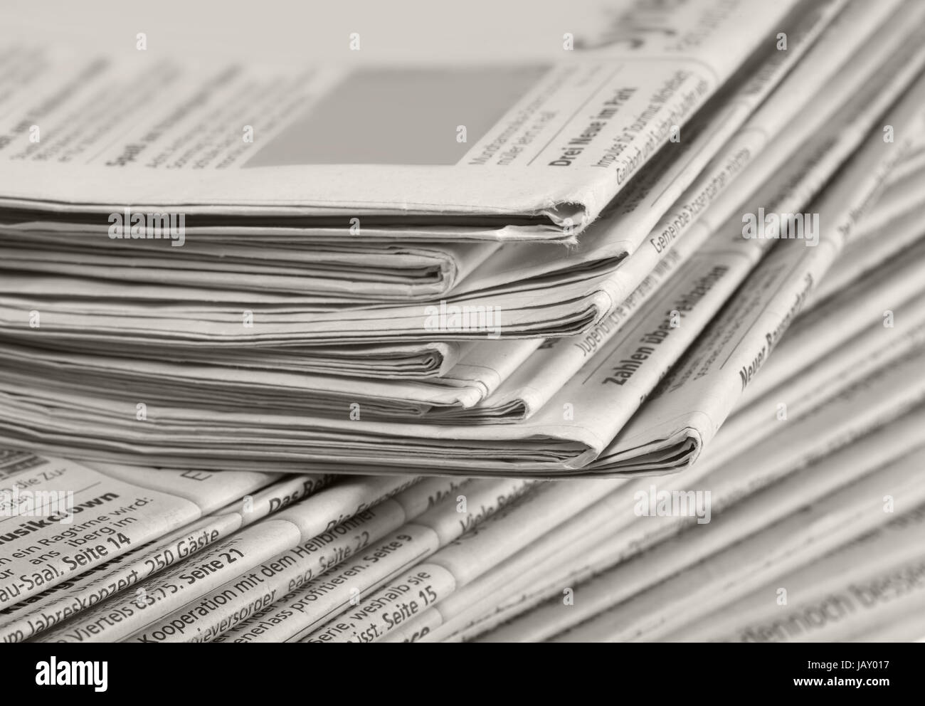 full frame background with lots of stacked newspapers Stock Photo