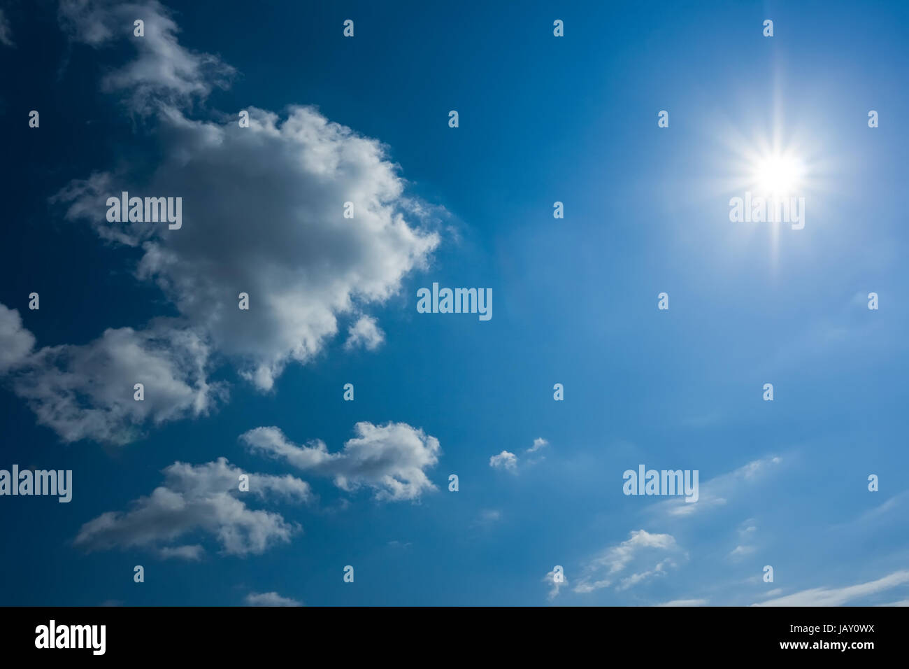 White clouds in blue summer sky background Stock Photo - Alamy