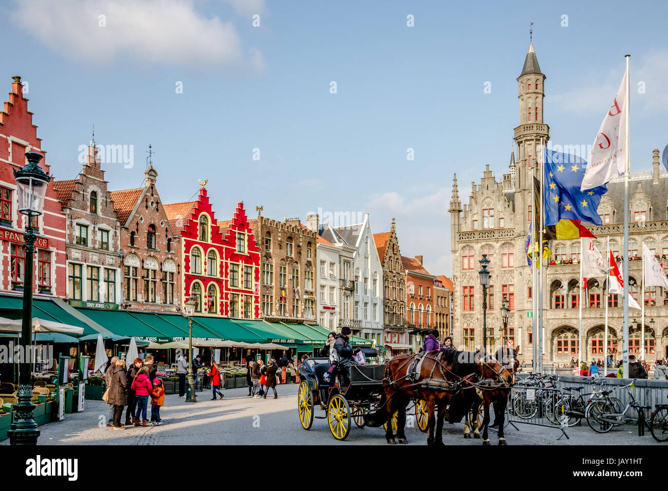 Colorful Buildings and a Horse Carriage at Grote Markt Square in Bruges Stock Photo