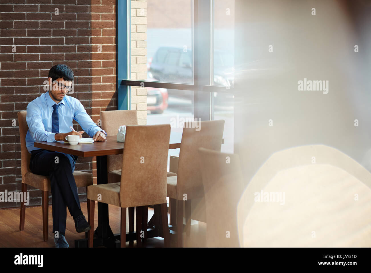Taking Notes During Coffee Break Stock Photo Alamy