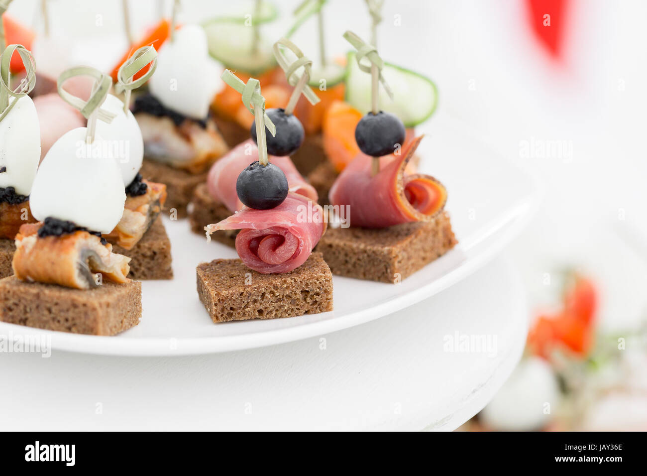 the buffet at the reception. Assortment of canapes. Banquet service. catering food Stock Photo