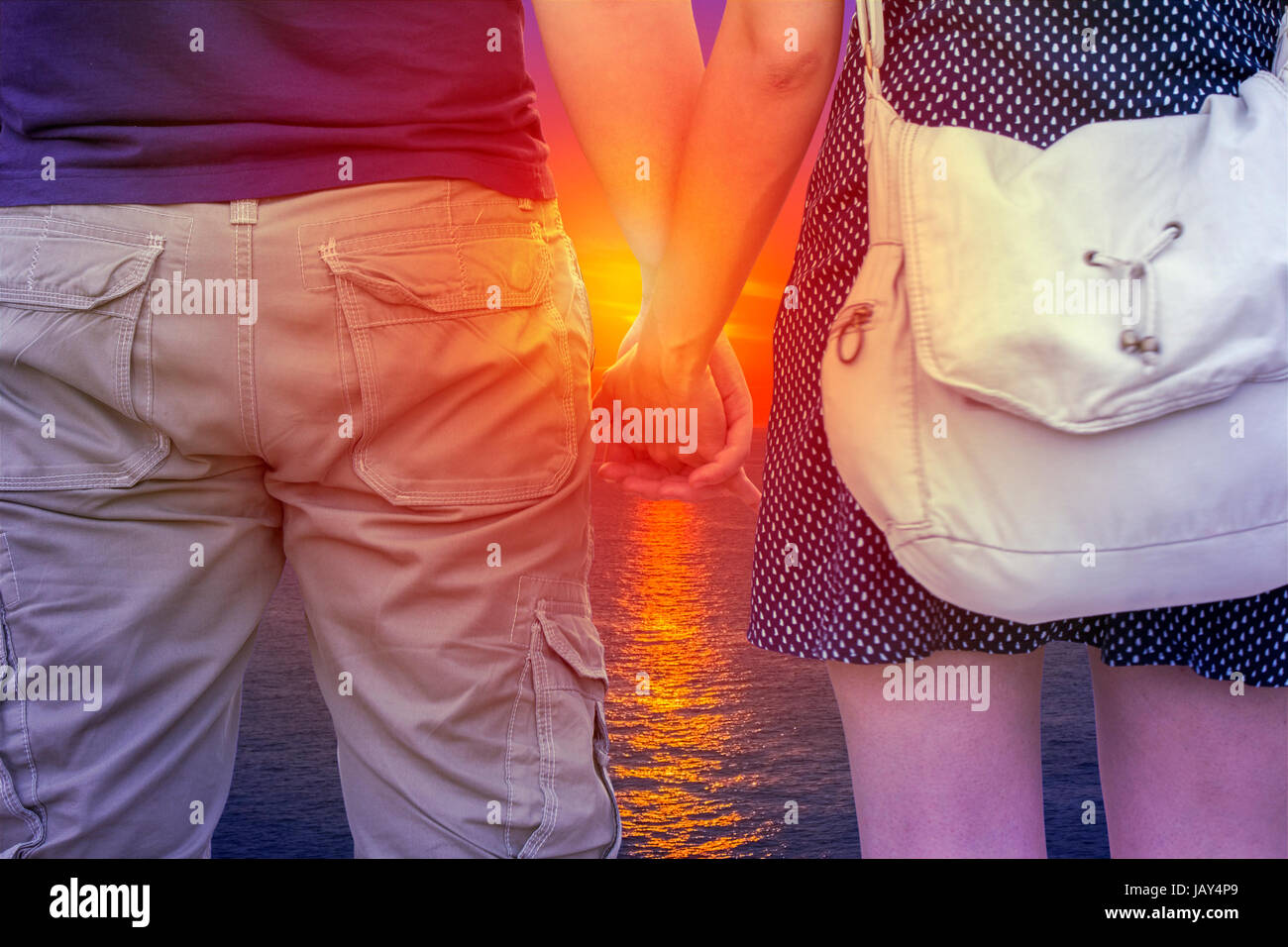 Young couple holding hands beach hi-res stock photography and images ...