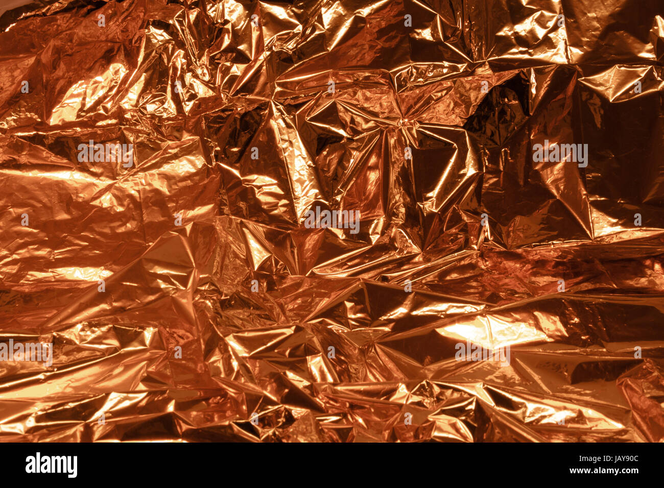 Copper foil texture background. Golden shine metallic gradient