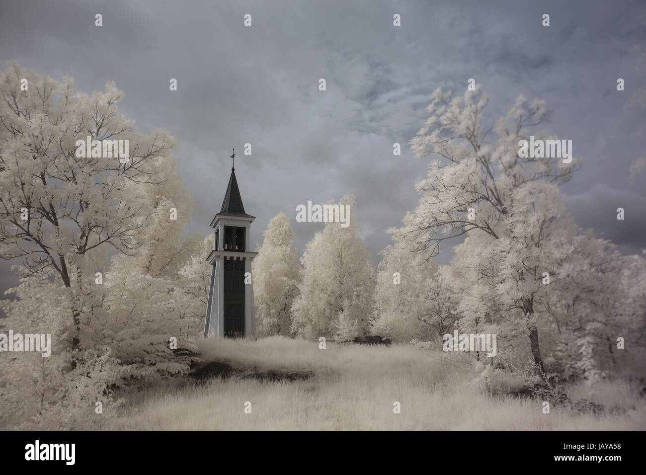 A very old wooden bell tower in Finspang, Sweden IR Stock Photo