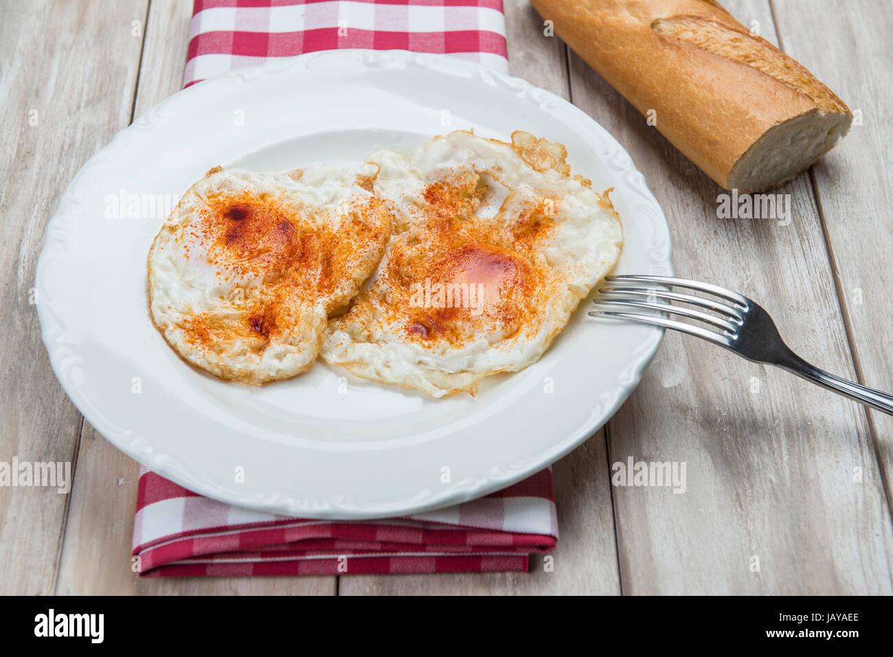 A dish of fried eggs with bread Stock Photo - Alamy