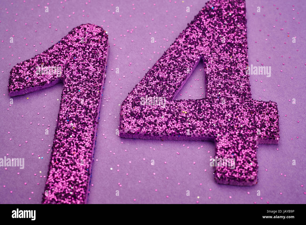 Number fourteen purple color over a purple background. Anniversary.  Horizontal Stock Photo - Alamy