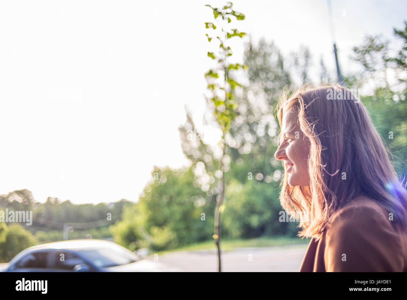 A woman walking the street Stock Photo - Alamy