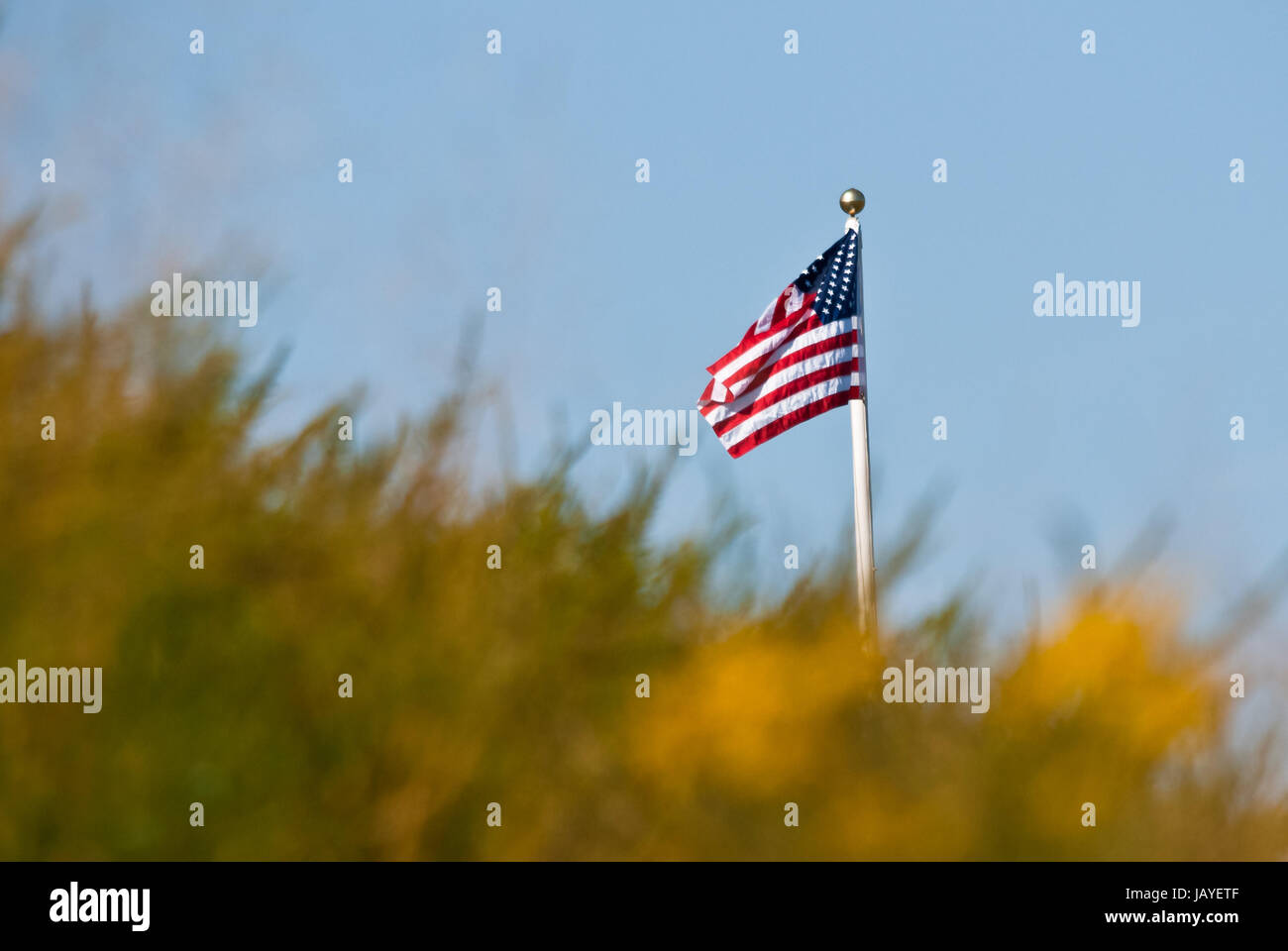 Flag Beyond The Hill Stock Photo