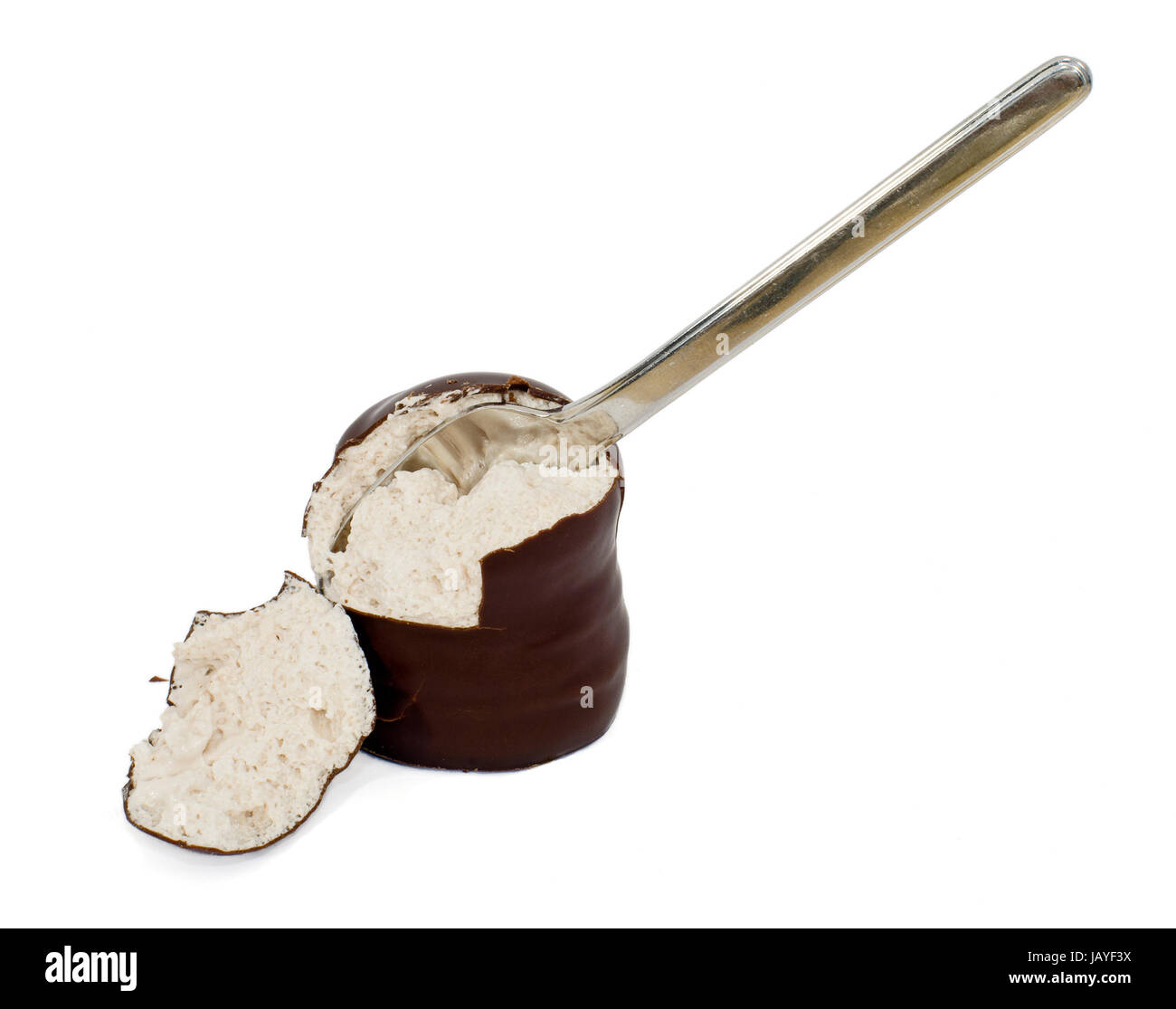 Schokokuss mit Löffel; chocolate covered marshmallow treat and a small spoon Stock Photo