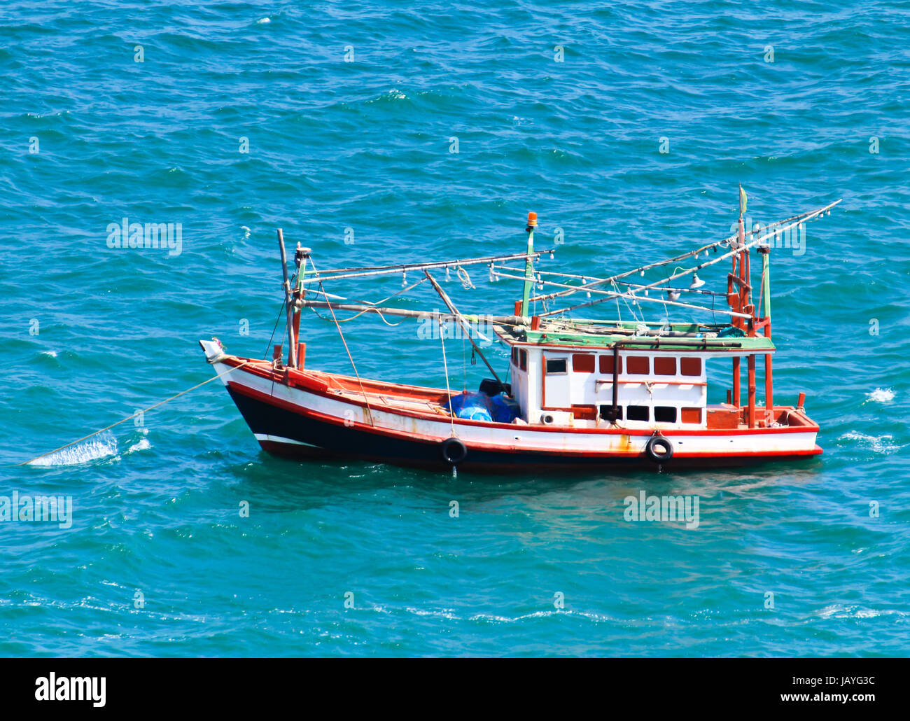 Wooden fishing boat on sea Stock Photo - Alamy