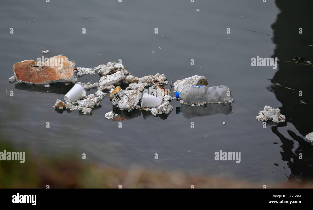 Plastic and polystyrene pollution floating in Southampton water  where cruise ships and container ships come to dock in Southamptons busy Port. Stock Photo