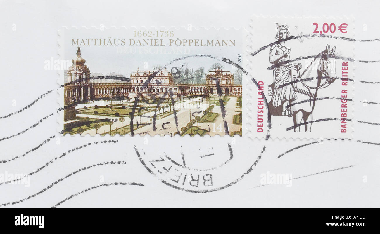 BERLIN, GERMANY - DECEMBER 27, 2013: German stamps with Matthaeus Daniel Poepperman and Bamberger Reiter Stock Photo