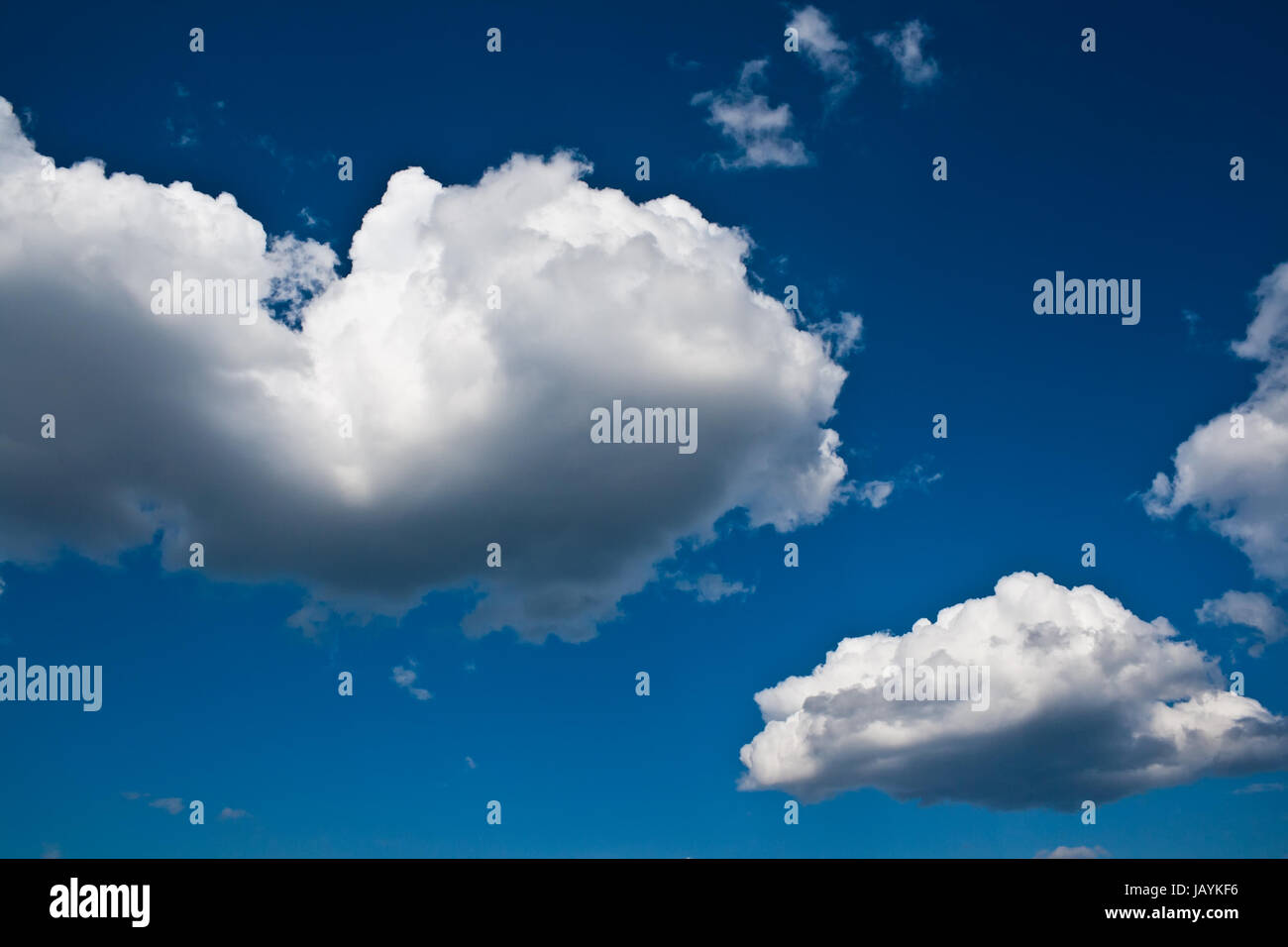 White clouds in blue summer sky background Stock Photo - Alamy