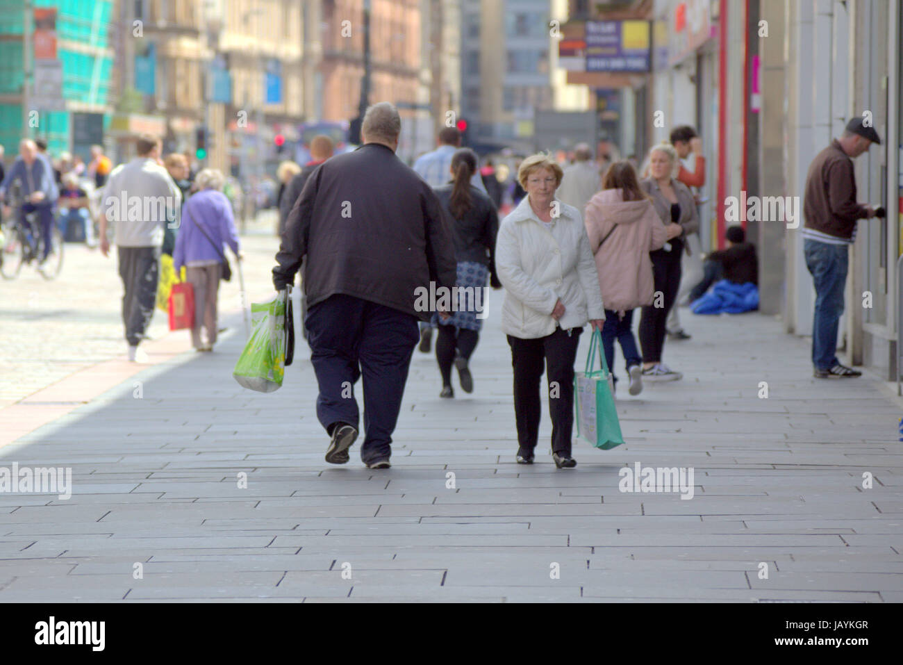 overweight obese man shopping om the streets of Glasgow Argyle Street Stock Photo