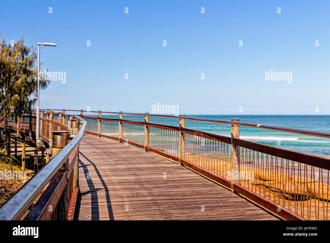 The boardwalk connects the beaches at Caloundra, Queensland, Australia. People use the boardwalk for walks, jogging, cycling and just hanging around. Stock Photo