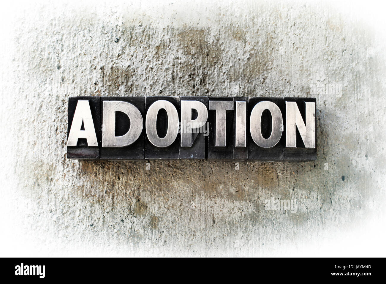 The word "ADOPTION" written in old vintage letterpress type Stock Photo