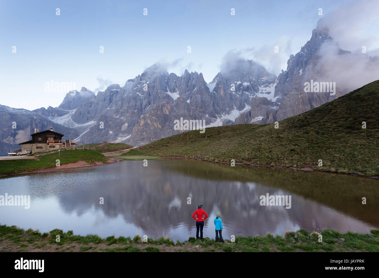 Mother and son standing by the lake at Baita Segantini, Dolomites, Italy. Stock Photo