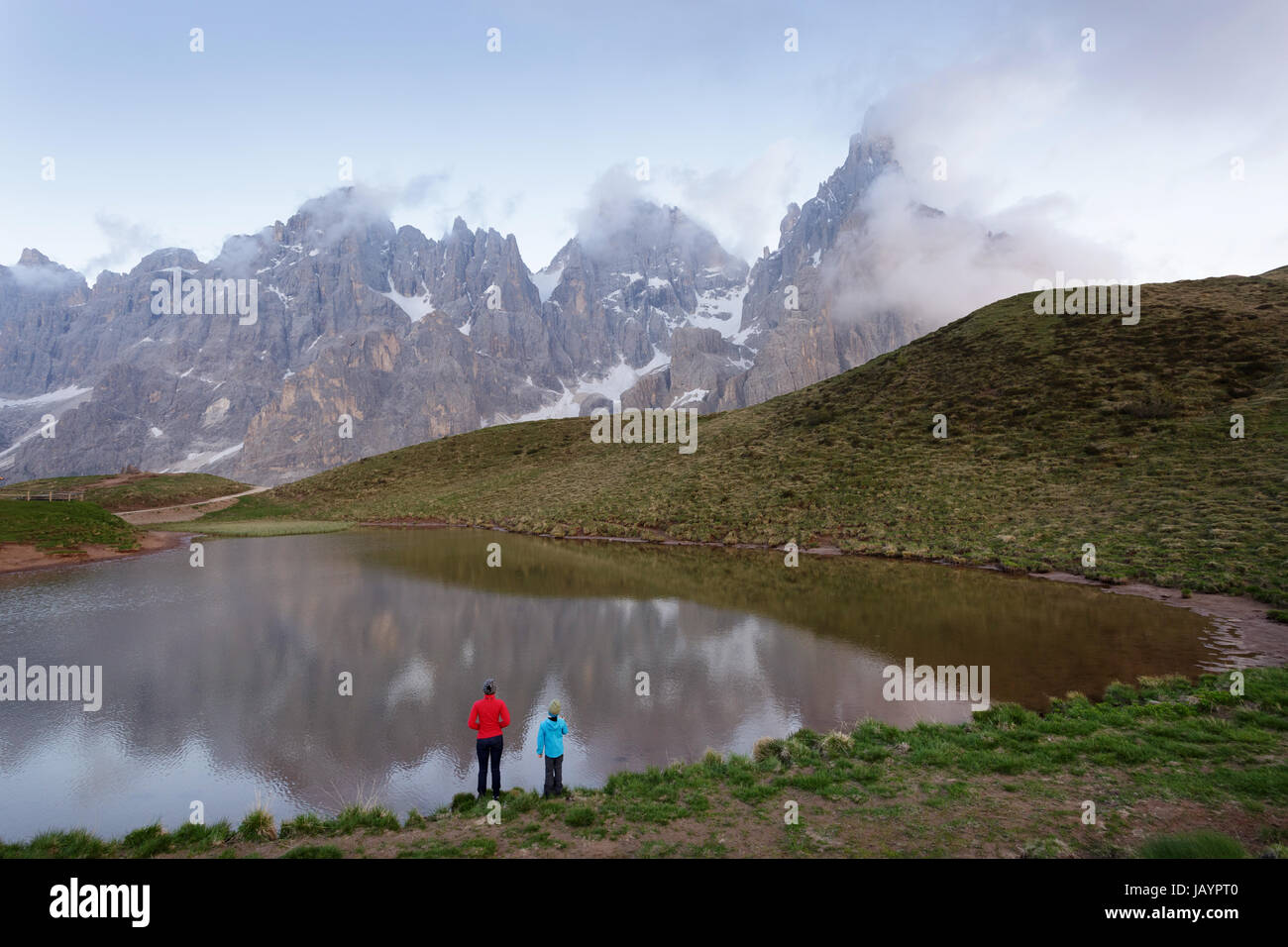 Mother and son standing by the lake at Baita Segantini, Dolomites, Italy. Stock Photo