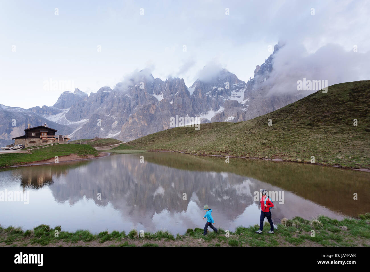 Mother and son standing by the lake at Baita Segantini, Dolomites, Italy. Stock Photo