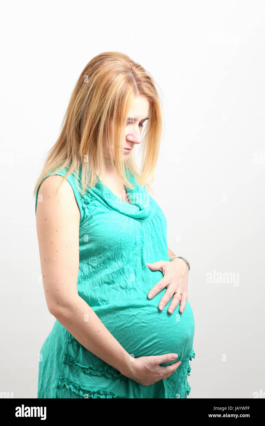 Deatails of a portrait of a pregnant woman isolated on white. Stock Photo