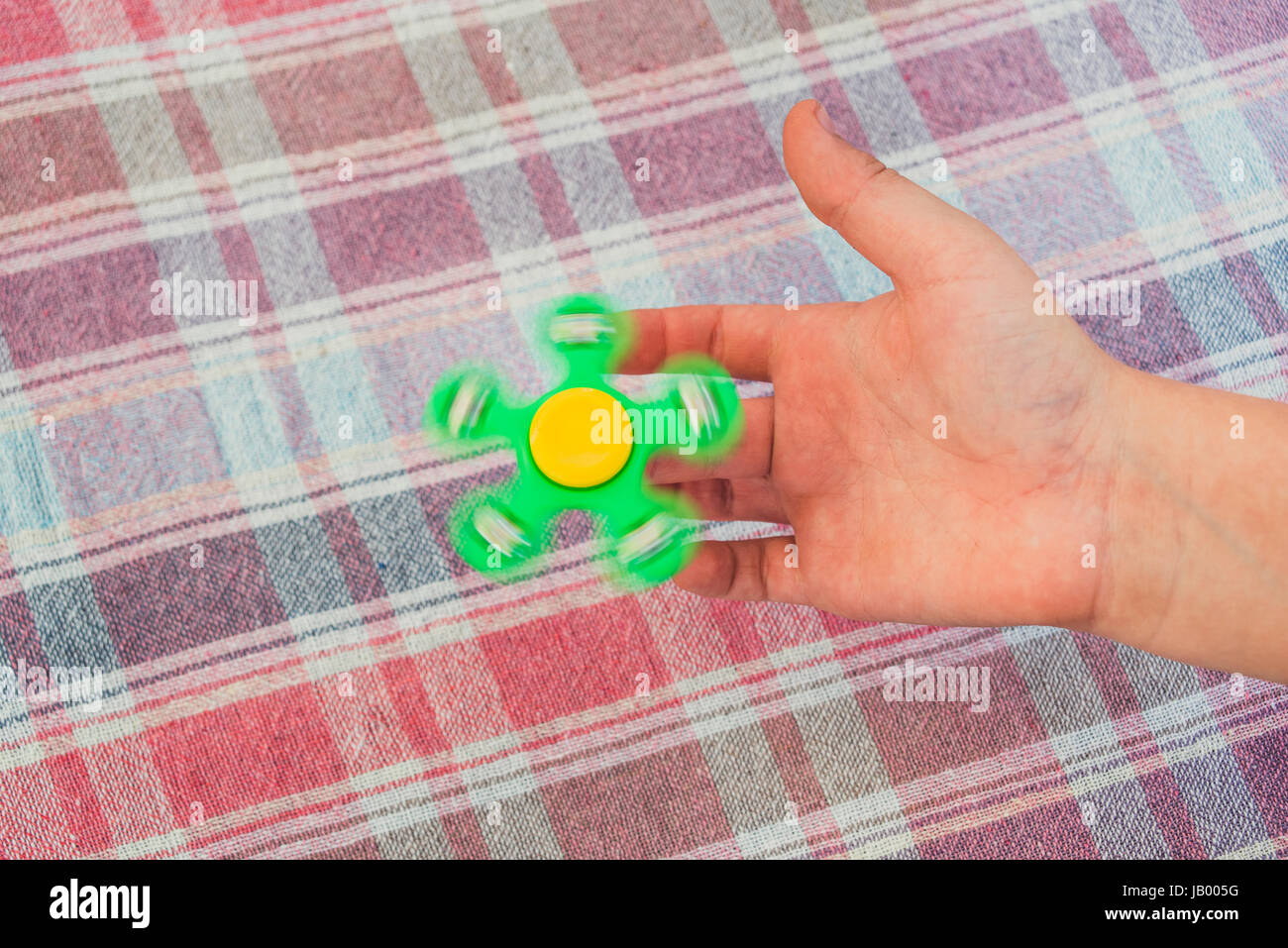 Green fidget spinner Stock Photo