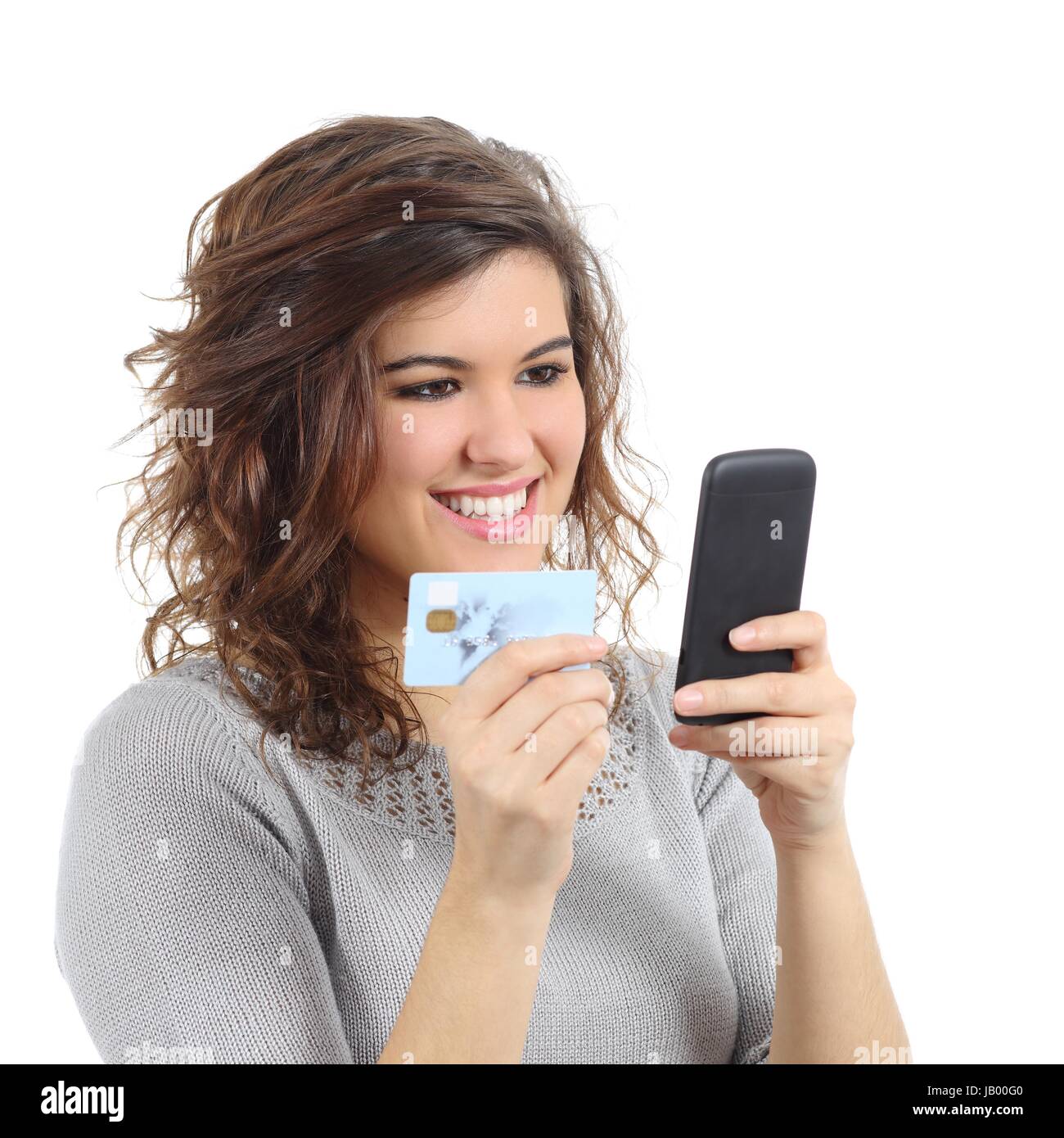 Beautiful woman holding a credit card buying on the smart phone