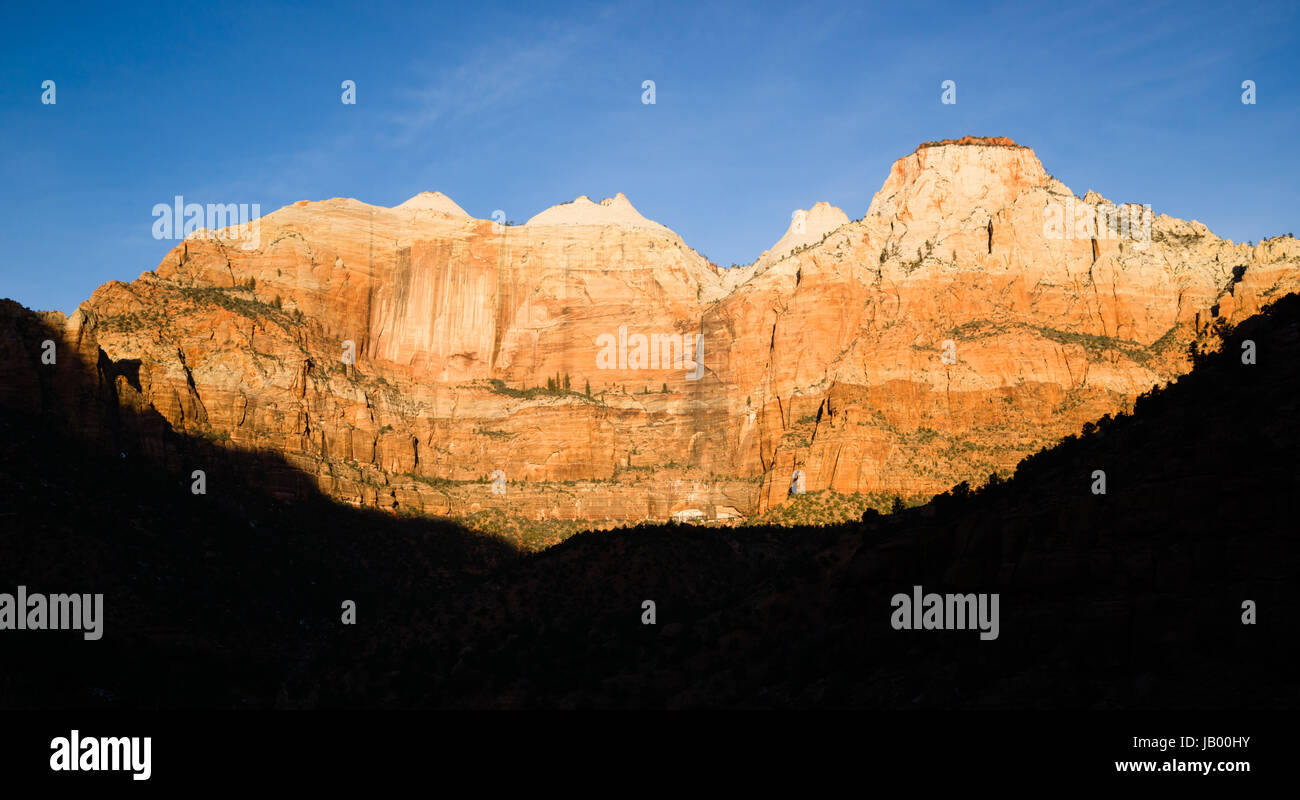 The light has not quite reached the valley int this vertical composition of early morning in the desert Southwest Stock Photo