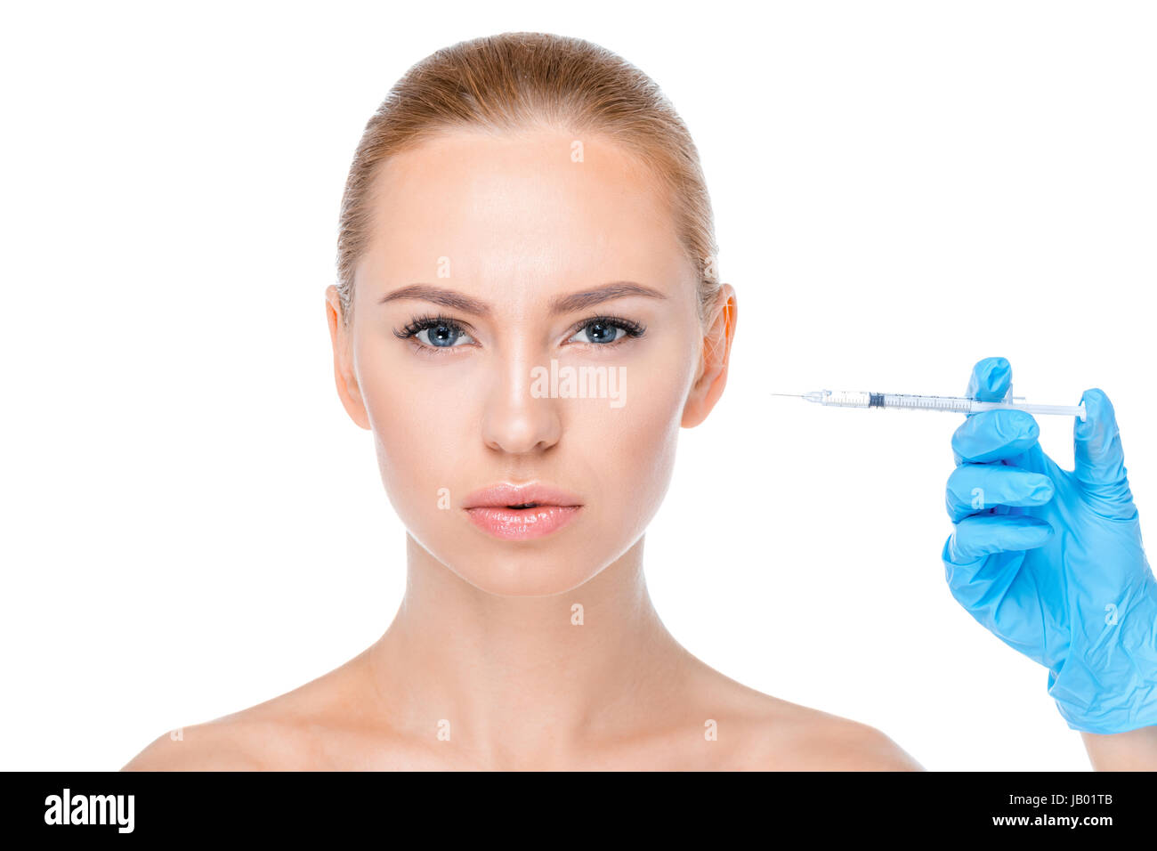 portrait of serious woman getting botox injection on white Stock Photo