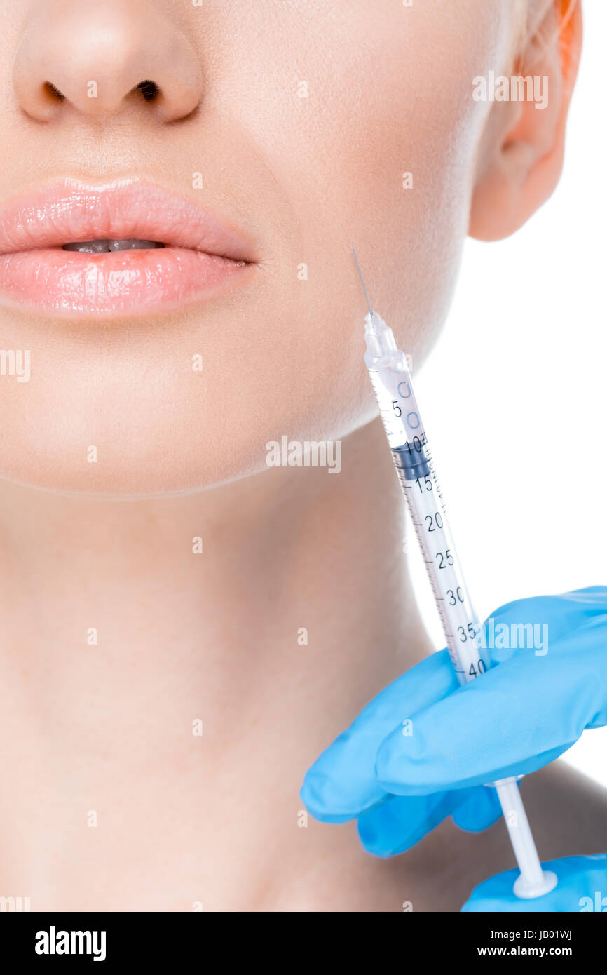 partial view of woman getting botox injecton on white Stock Photo