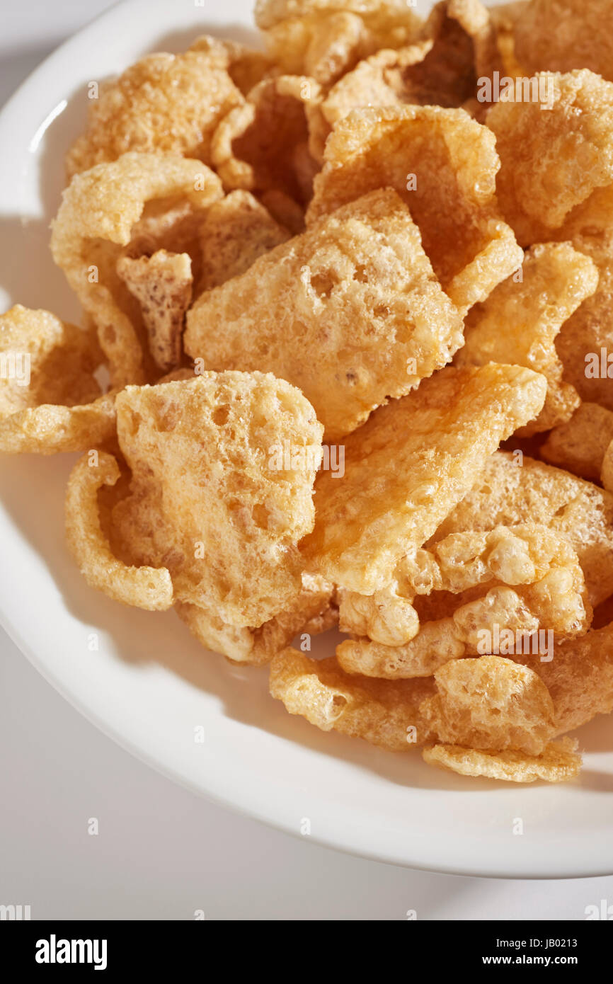 a bowl of fried pork skins Stock Photo Alamy
