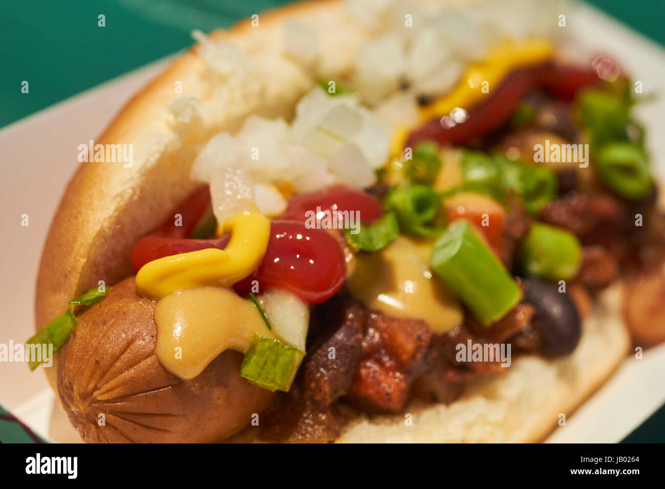 vegan hot dog with Mexican style toppings at a food festival in