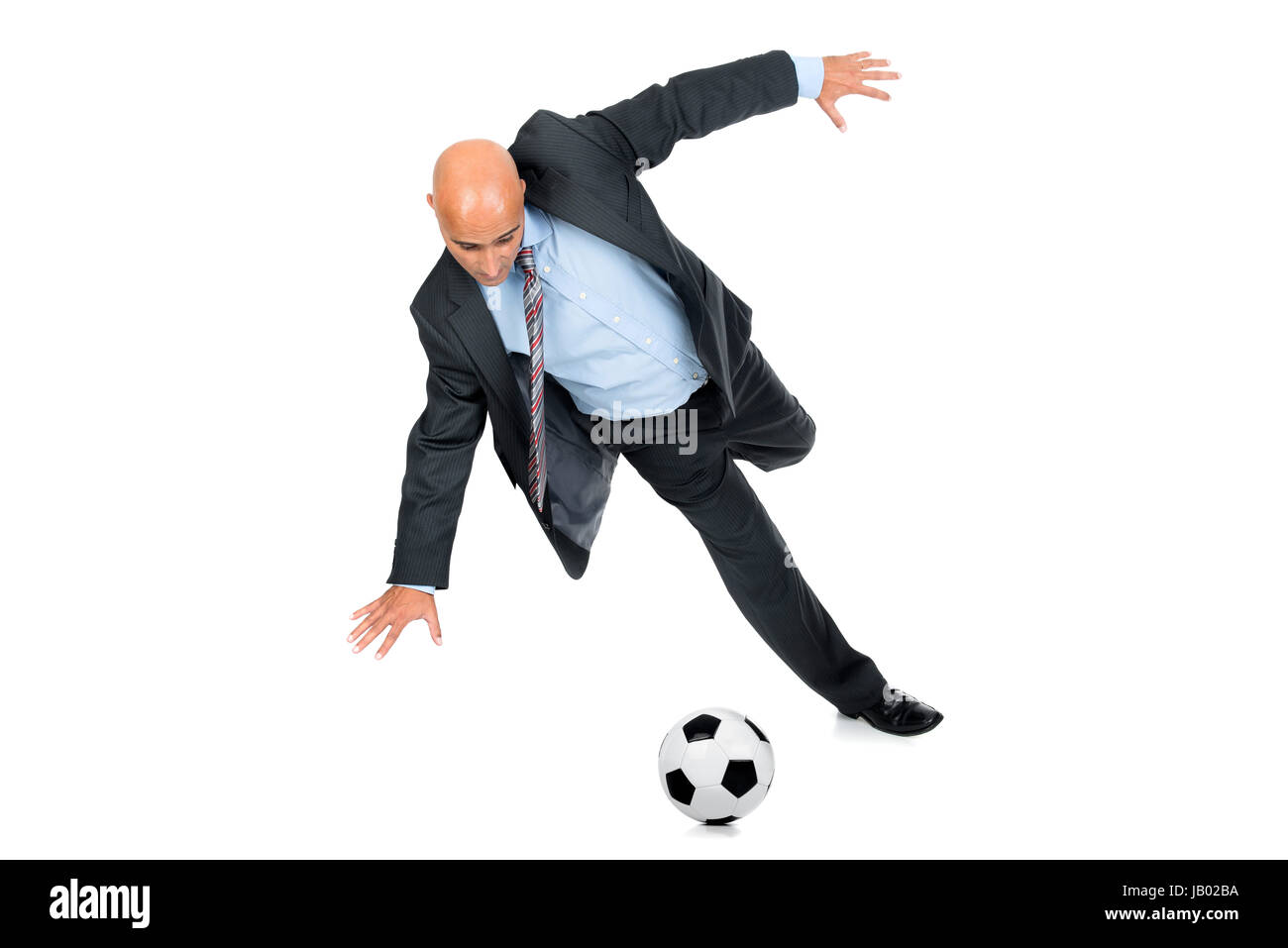 Businessman playing soccer ball isolated in white Stock Photo - Alamy