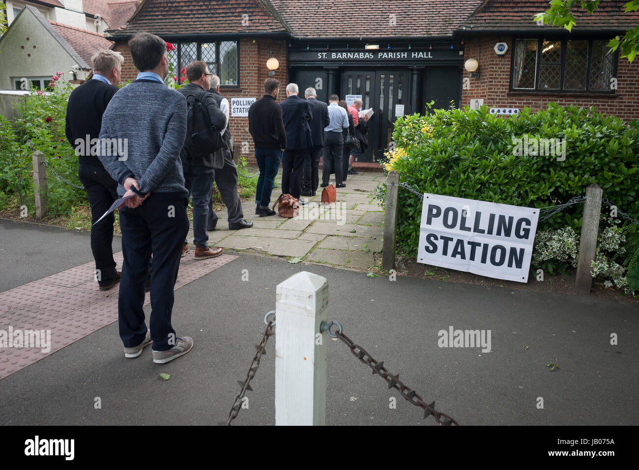 early-voters-for-the-uk-2017-general-elections-queue-outside-the-polling-JB075A.jpg