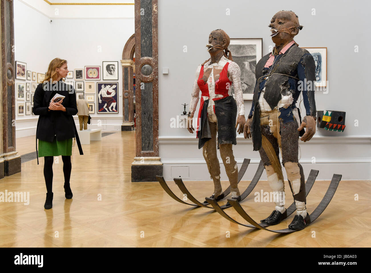 London, UK.  8 June 2017.  A visitor views a sculpture called 'Defending Integrity From The Power That Be' by Tim Shaw RA.  Preview of the Summer Exhibition 2017 at the Royal Academy of Arts in Piccadilly.  Co-ordinated by Royal Academician Eileen Cooper, the 249th Summer Exhibition is the world's largest open submission exhibition with around 1,100 works on display by high profile and up and coming artists.   Credit: Stephen Chung / Alamy Live News Stock Photo