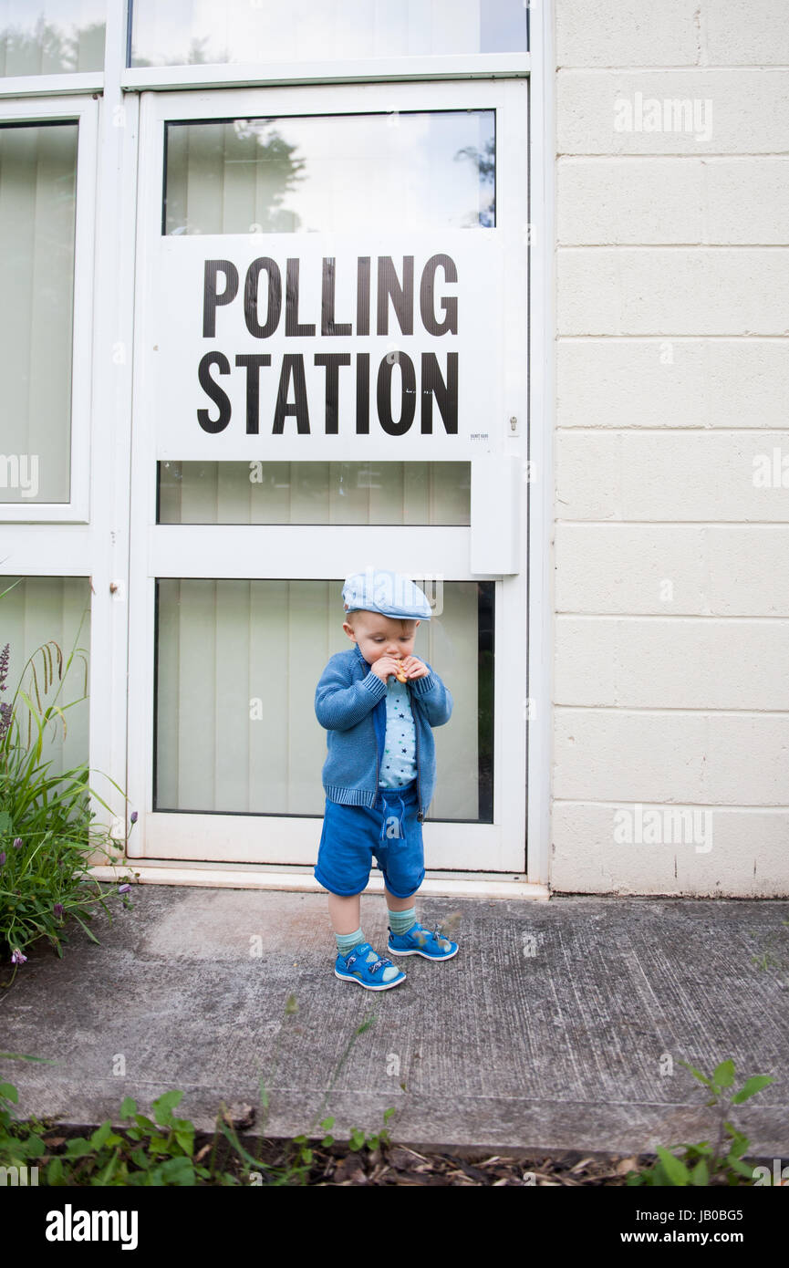 UK Election: Toddler waiting at Polling Station in Yate, North Bristol Stock Photo