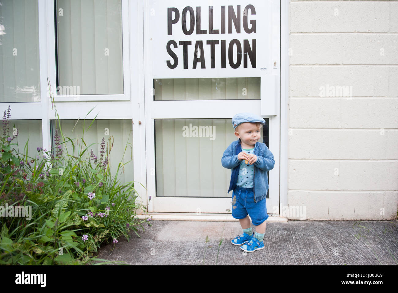 UK Election: Toddler waiting at Polling Station in Yate, North Bristol Stock Photo