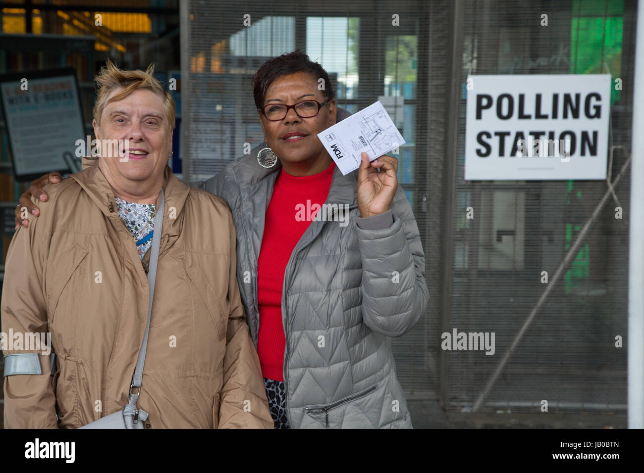 London, UK. 8th June, 2017. A mother and daughter stand out side a polling station at Peckham Library in south London on June 8, 2017, as Britain holds a general election. Credit: Thabo Jaiyesimi/Alamy Live News Stock Photo