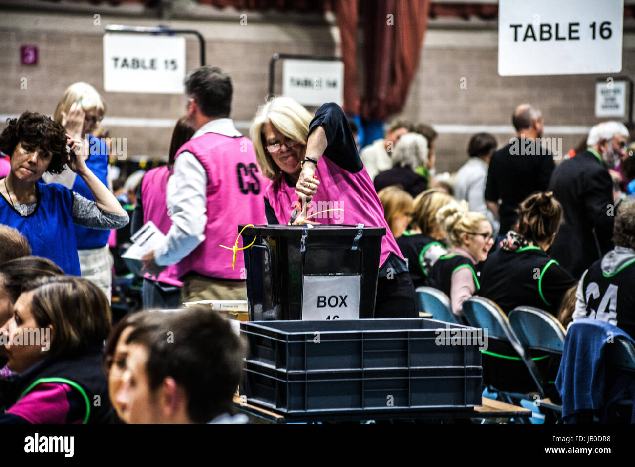 Hereford, UK. 08th June, 2017. A woman breaks the seals on a ballot box. The counting of votes is underway in Hereford. The latest opinion polls suggest British Prime Minister Theresa May's Conservative Party is on course to win today's national election comfortably. May called the election in April less than a year after she became prime minister in the political turmoil that followed Britain's vote to leave the European Union. Saying she wanted to go into the Brexit negotiations with a position of strength. Credit: Jim Wood/Alamy Live News Stock Photo
