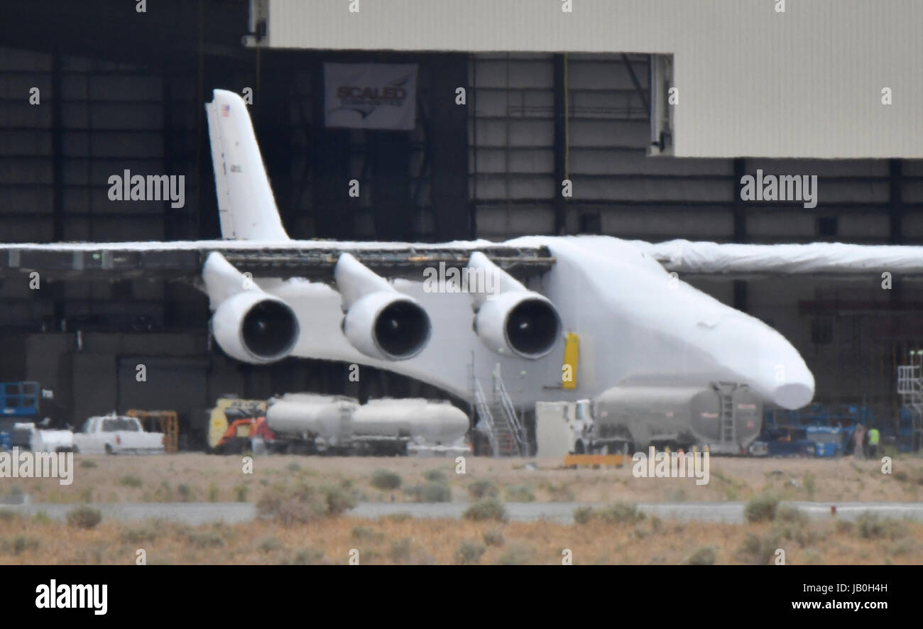 May 31, 2017. Mojave, California, U.S. - Paul Allen's Stratolaunch carrier makes it's first out of the hanger appearance Wednesday. The Stratolaunch was rolled out to start fuel testing on it's tanks. The plane is built by Scaled Composites and called the ''Roc, '' The plane has the longest wingspan of any aircraft ever built: 385 feet from tip to tip. The six-engine mothership is designed to carry rockets between its two fuselages. Once at altitude, the mega-plane will drop the launch vehicle, which will then fire its boosters and launch to space from the air. (Credit Image: © Gene Blevins vi Stock Photo