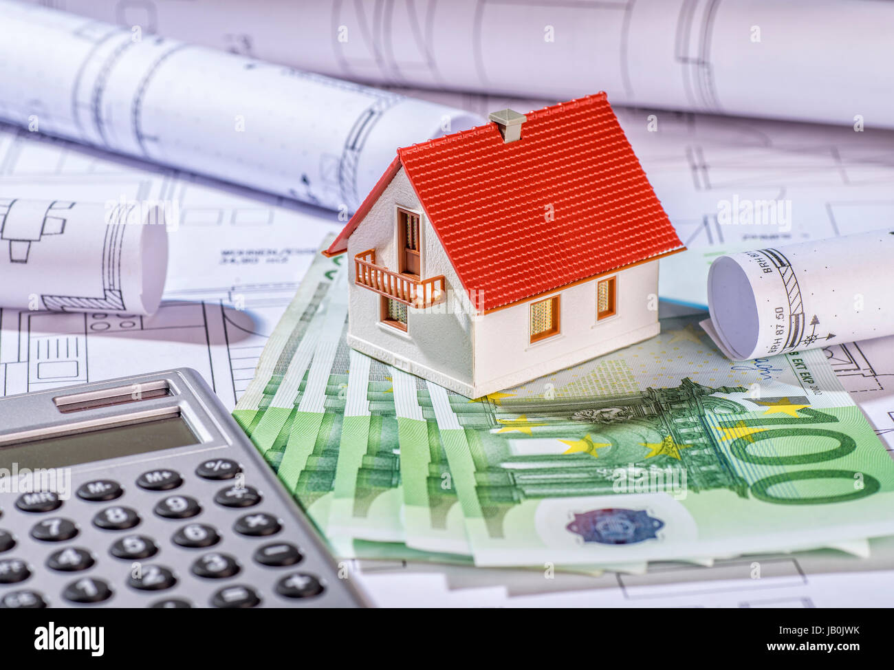 House with bills, plans and calculator Stock Photo Alamy
