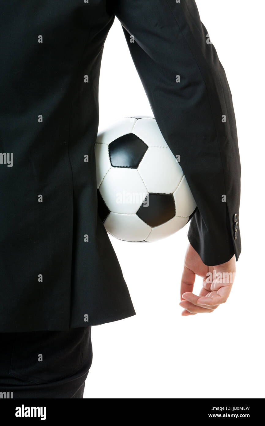 Businessman holding soccer ball Stock Photo - Alamy