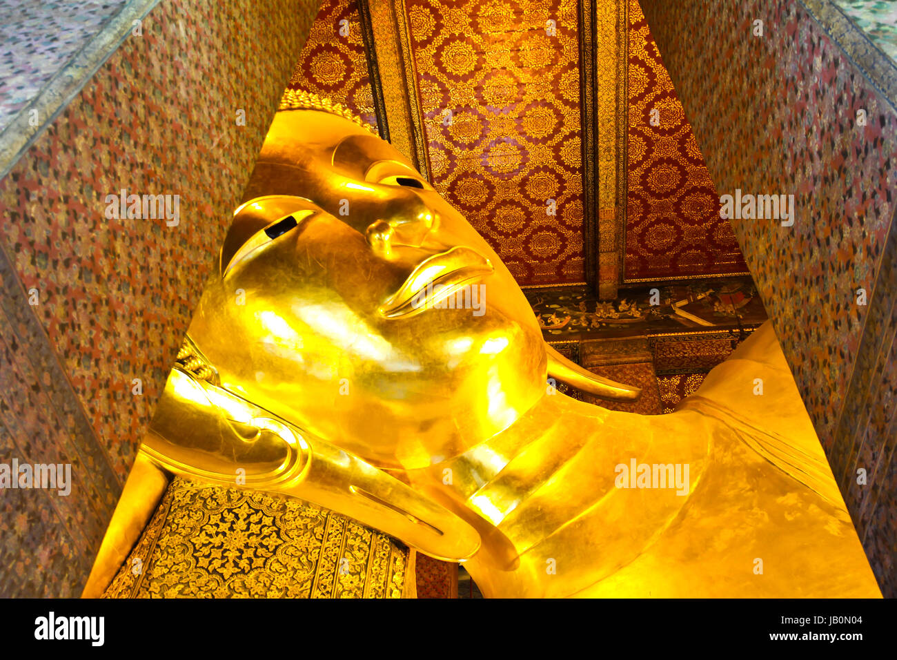 Reclining Buddha gold statue face. Wat Pho, Bangkok, Thailand Stock ...