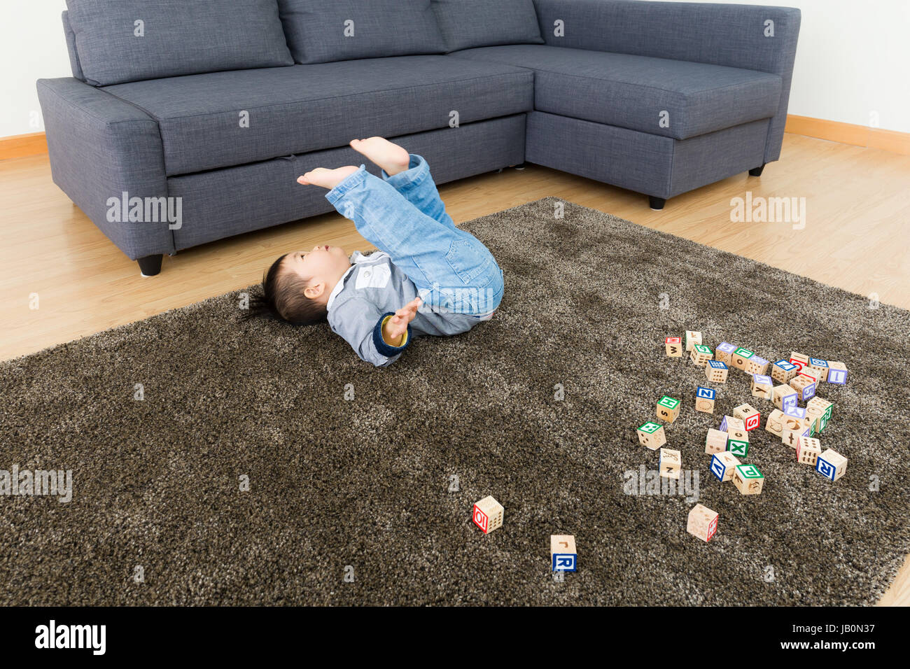 Asian baby boy try to do somersault Stock Photo Alamy