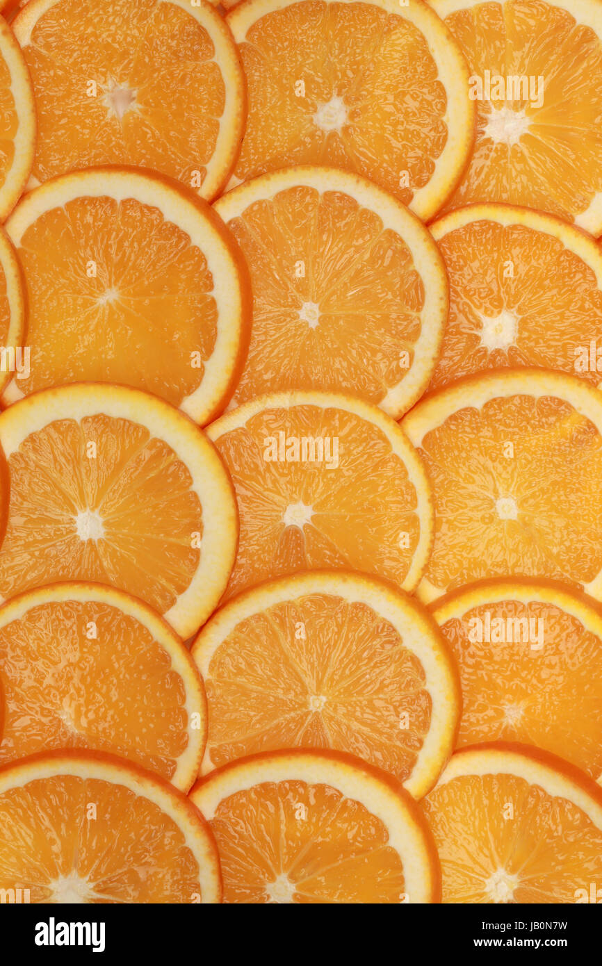 Geschnittene Orangen Scheiben bilden einen Hintergrund Stock Photo