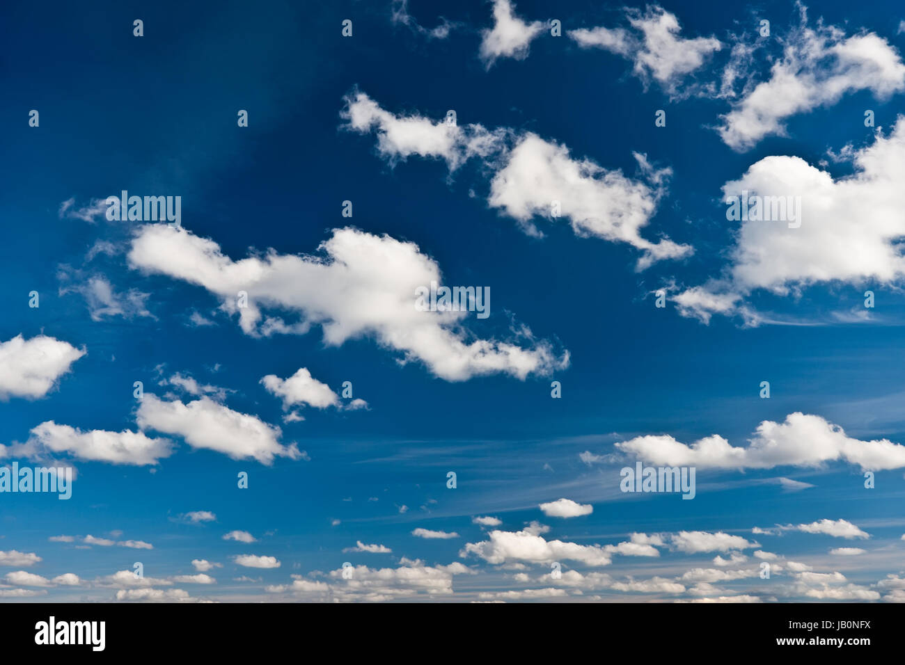 White clouds in blue summer sky background Stock Photo - Alamy