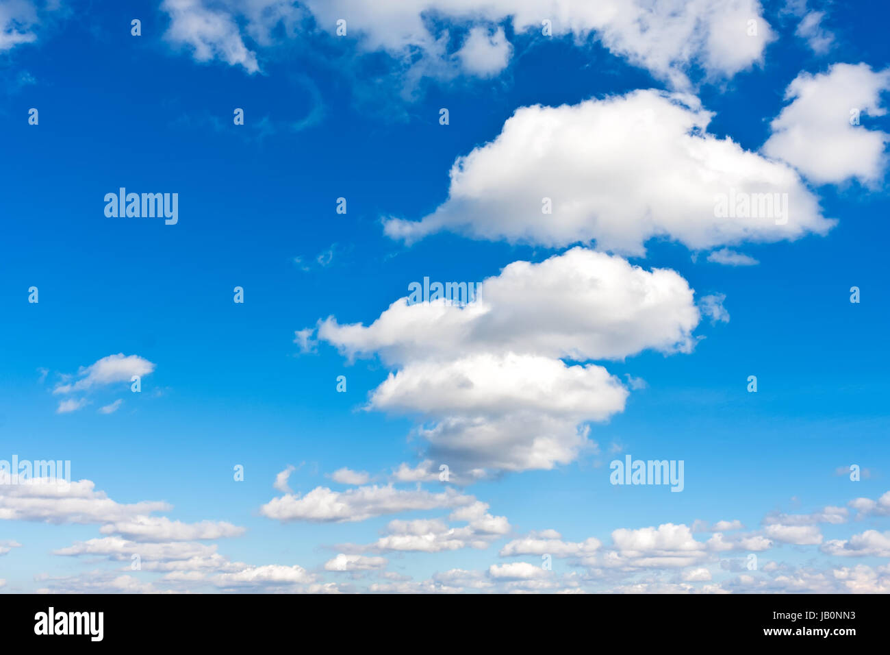 White clouds in blue summer sky background Stock Photo - Alamy