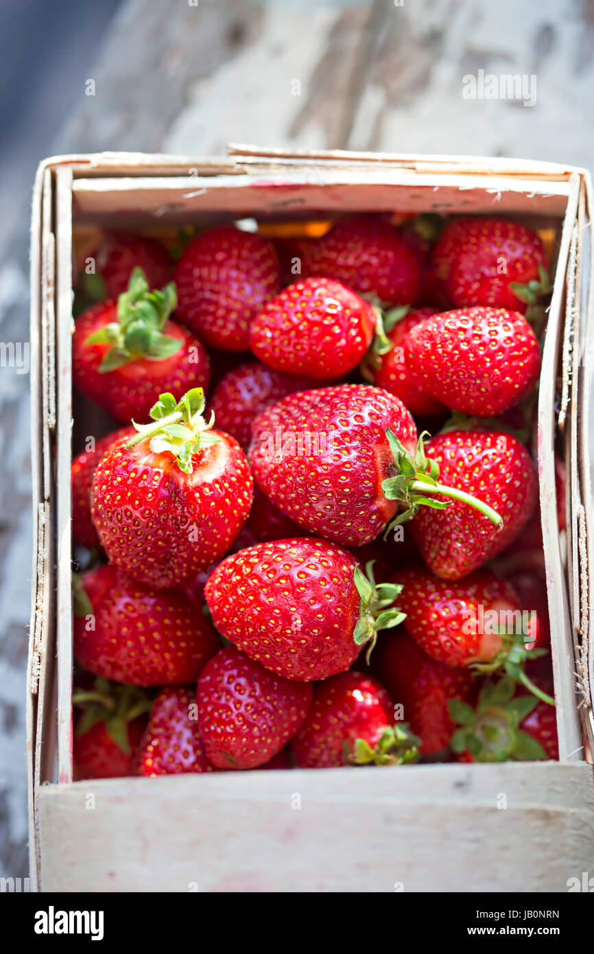 Strawberries on white wooden background Stock Photo - Alamy
